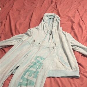 Selena Gomez light blue jacket and sweatpants